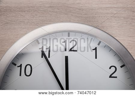 Clock Showing Five Before Noon