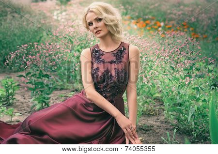 Beautiful woman in spring garden
