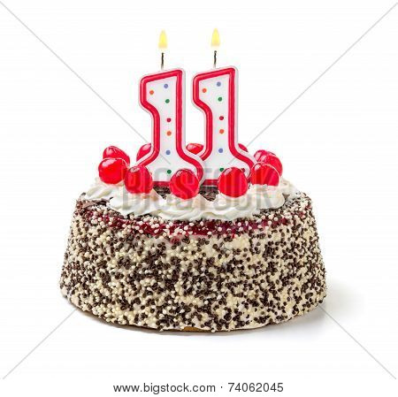 Birthday cake with burning candle number 11