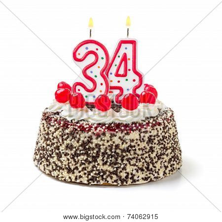 Birthday cake with burning candle number 34