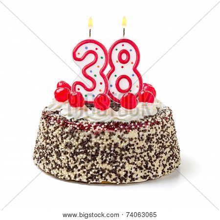 Birthday cake with burning candle number 38