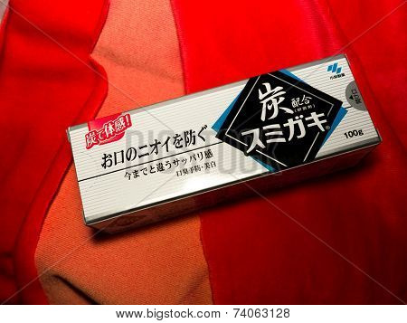 GOMEL, BELARUS - AUGUST 23, 2014:Japanese toothpaste Kobayashi with charcoal.Kobayashi Pharmaceutical Co., Ltd. manufactures and sells OTC pharmaceuticals, oral hygiene products.