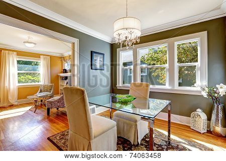 Dining Table With Glass Top And Two Elegant Chairs