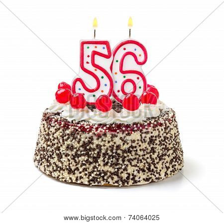 Birthday cake with burning candle number 56