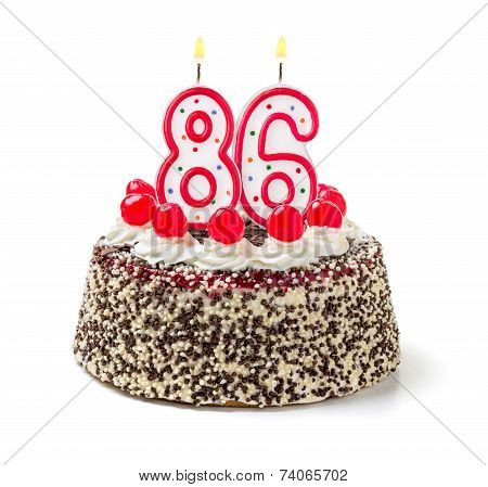 Birthday cake with burning candle number 86