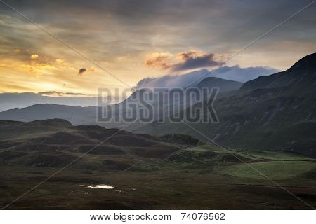 Stunning Sunrise Mountain Landscape With Vibrant Colors And Beautiful Cloud Formations