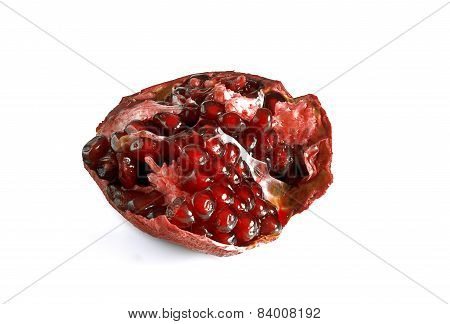 A Half Of Pomegranate On A White Background.
