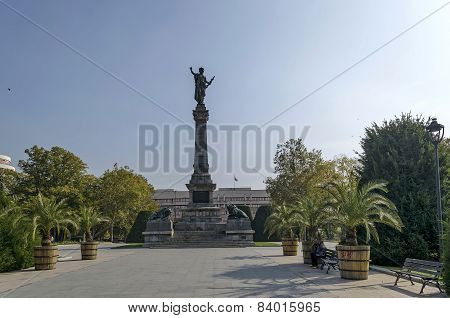 Avenue with palm and monument in Ruse garden