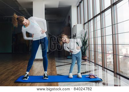 Two Girls Of Different Ages Makeing Yoga