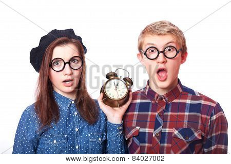 Teen Couple With Clock Alarm.
