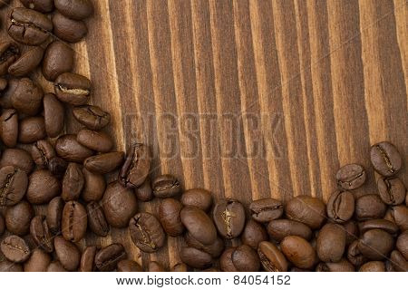 Coffee beans on the  rustic wood background