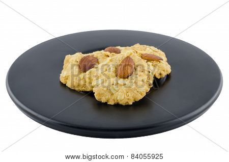 Almond Cookies On Black Dish And Isolate On White Background With Clipping Path