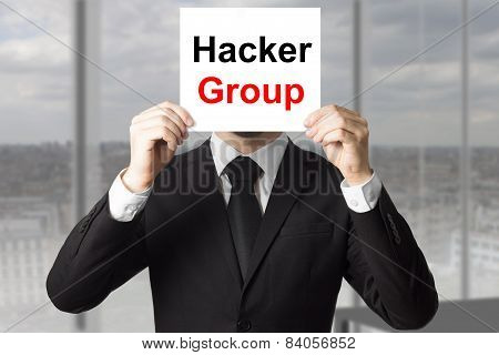 Businessman Hiding Face Behind Sign Hacker Group