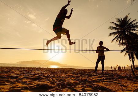 Teenagers Balance On Slackline Silhouette