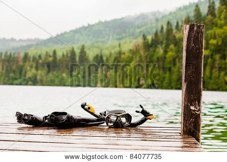 Snorkeling Mask And Tuba On Dock