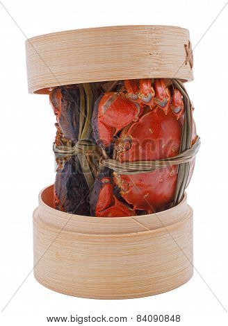 Hairy crabs on the Bamboo steamer Isolated in white background.