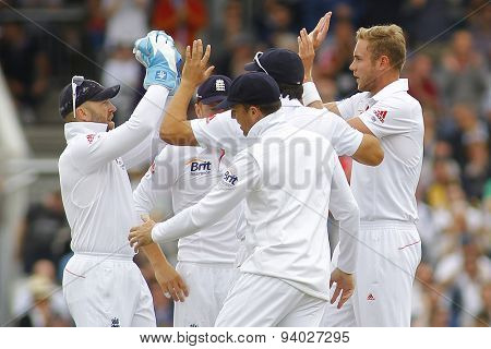 MANCHESTER, ENGLAND - August 04 2013: England celebrates the wicket of Chris Rogers, caught Matt Prior bowled by Stuart Broad during  the Investec Ashes 4th test match at Old Trafford Cricket Ground