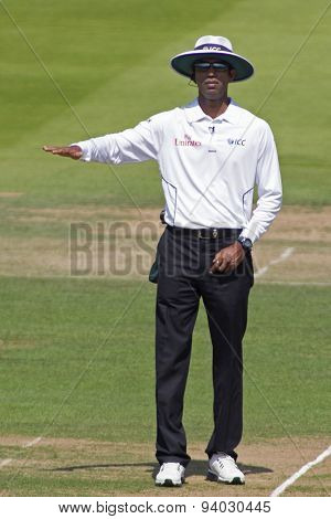 LONDON, ENGLAND - July 18 2013: Kumar Dharmasena signals four runs on day one of the Investec Ashes 2nd test match, at Lords Cricket Ground on July 18, 2013 in London, England.