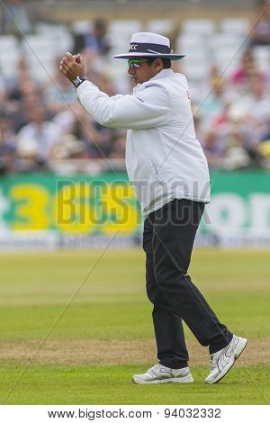 NOTTINGHAM, ENGLAND - July 14, 2013:  Umpire Aleem Dar signals for ground staff to carry out repairs during day five of the first Investec Ashes Test match at Trent Bridge Cricket Ground