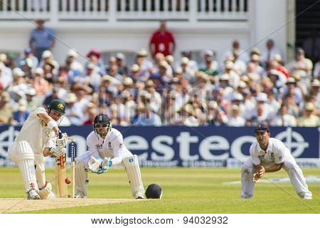 NOTTINGHAM, ENGLAND - July 13, 2013: Ed Cowan hits the balland is caught by Jonathan Trott  during day four of the first Investec Ashes Test match at Trent Bridge Cricket Ground on July 13, 2013 