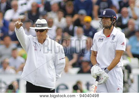 CHESTER LE STREET, ENGLAND - August 09 2013: Umpire Tony Hill signals out for Jonathan Trott as Alastair Cook looks on during day one of the Investec Ashes 4th test match