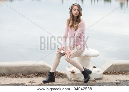 Girl With Mobile Phone And Headphones