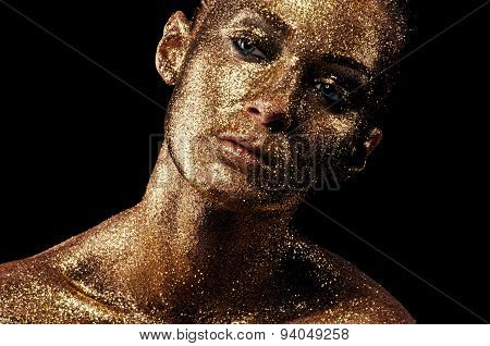 Gold makeup. Creative close-up portrait.