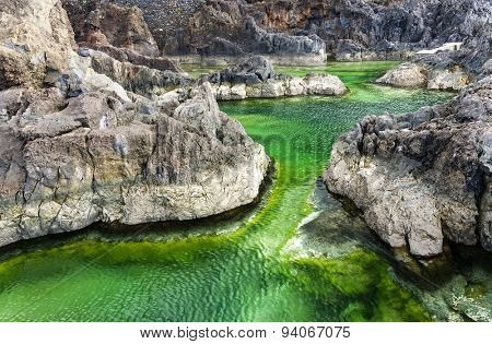 Swimming natural pools of volcanic lava in Porto Moniz, Madeira island, Portugal, Europe