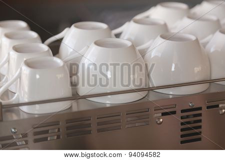 Empty coffee cup on coffee machine