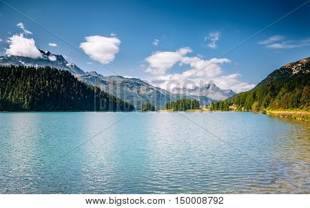 Great view of the azure pond Champfer in alpine valley. Popular tourist attraction. Picturesque and gorgeous scene. Location Swiss alps, Silvaplana village, district of Maloja, Europe. Beauty world.