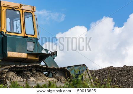 Excavators Construction machinery at a construction site in the background a blue sky.