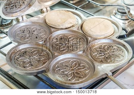 tigelliera pan to cook Tigelle traditional Bologna and Modena food