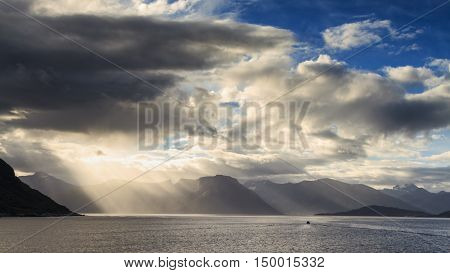 Sunbeams and clouds at the Hjorundfjord Fjordland Norway