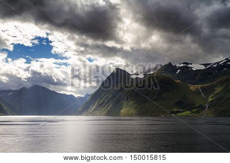 Dramatic landscape and cloudscape at Hjorundfjord Norway