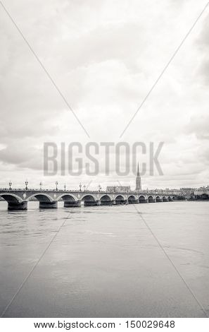 Old stony bridge in Bordeaux, France Europe