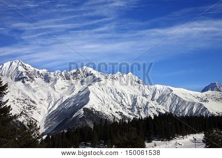 Winter Mountains And Ski Slope At Sun Winter Day
