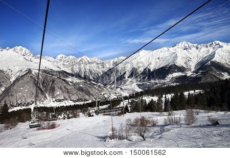 Chair-lift And Ski Slope In Snow Winter Mountains At Nice Sun Day