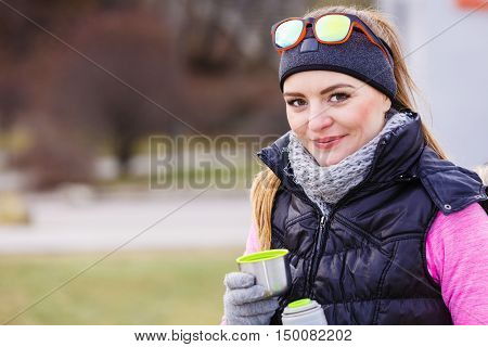 Hiker Woman Warming Up Drink Tea In Cold Day