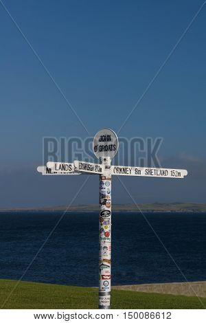 JOHN O GROATS, SCOTLAND--AUGUST 18, 2016--The popular signpost of John O Groats, a village in northern Scotland.  John O Groats is the destination point between the longest distance between two inhabited British points.