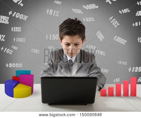 Young manager works with computer graph and stats
