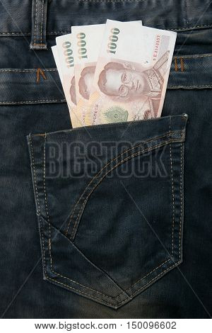 Thailand money bill in jean pocket in the room