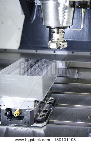 The face milling tool with the raw material work piece on the CNC milling machine.