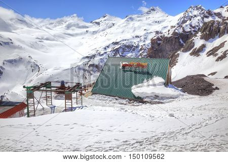 CAUCASUS RUSSIA - May 01.2015: Covered by snow on the roof alpine hotel on the hillside of mountain Elbrus