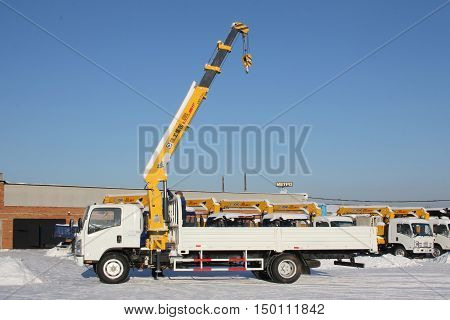 Great White Auto Truck Crane Standing On Construction Site In Winter - Russia, Crimea -january, 21,
