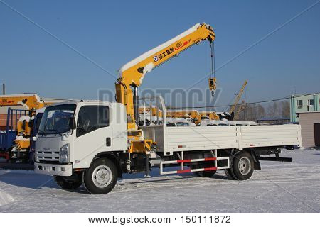 Great White Auto Truck Crane Standing On Construction Site In Winter - Russia, Crimea -january, 21,
