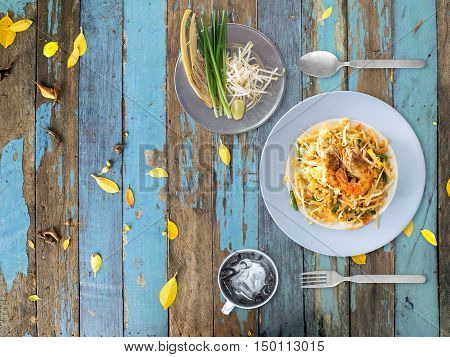 Top view of Pad Thai on the side of the table.
