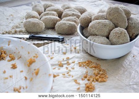 preparing Italian rice balls called suppli or arancine