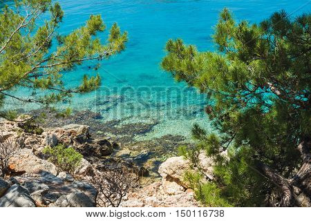 Mediterranean sea coast with clear sea water at Kastelorizo island on sunny day, Dodecanese, Greece