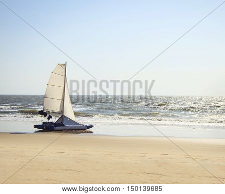 catamaran yacht standing on a deserted beach