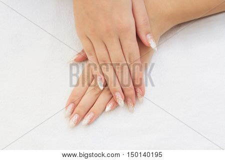 Beautiful female hands with french manicure close up